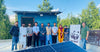 WWF Team standing Next to Solar Panel