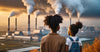An adult and a child facing industrial smokestacks emitting pollution.
